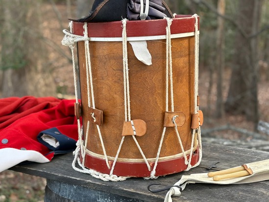 image of wooden drum with regimental coat
