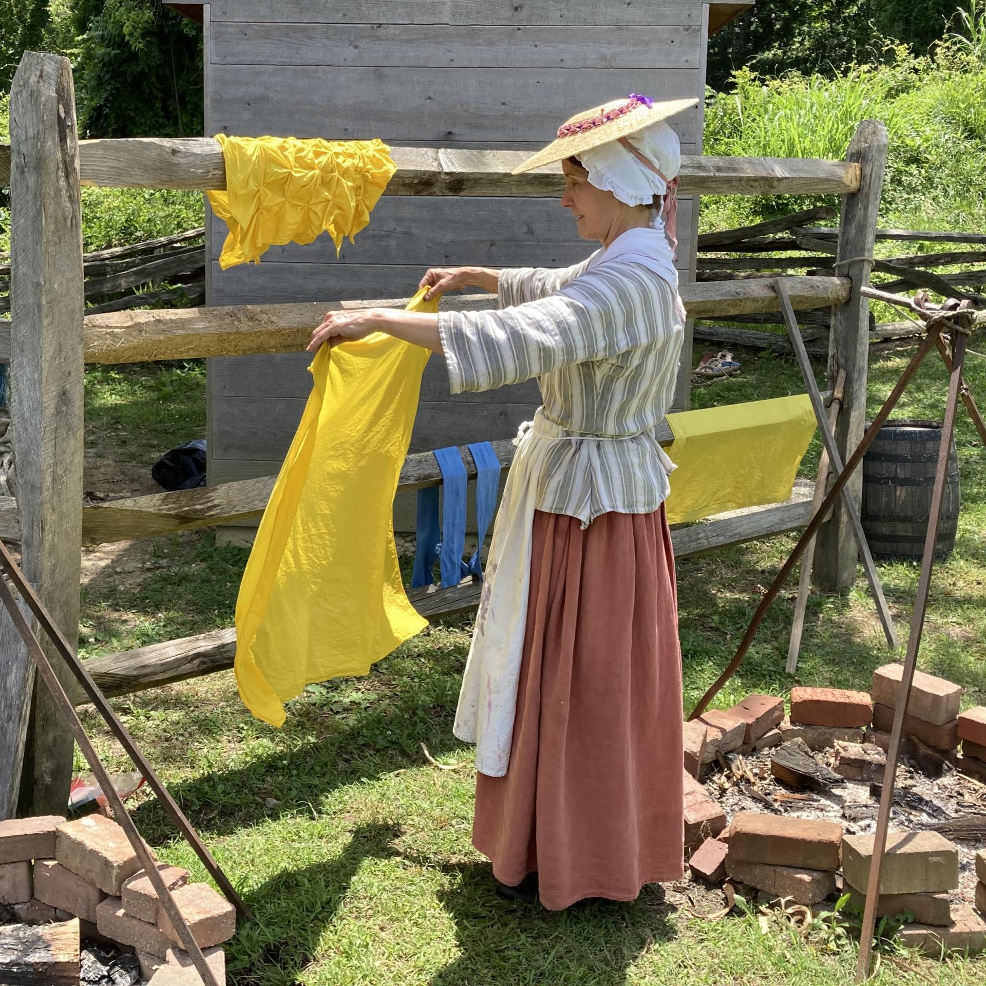 A woman dyeing cloth